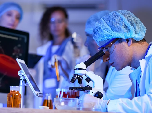 Person looking in microscope